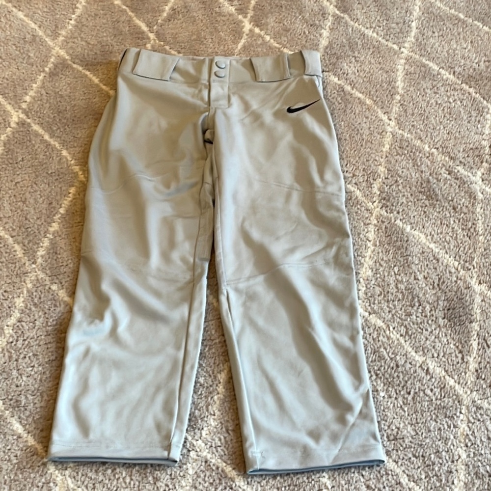 Boys gray baseball pants with black Nike logo